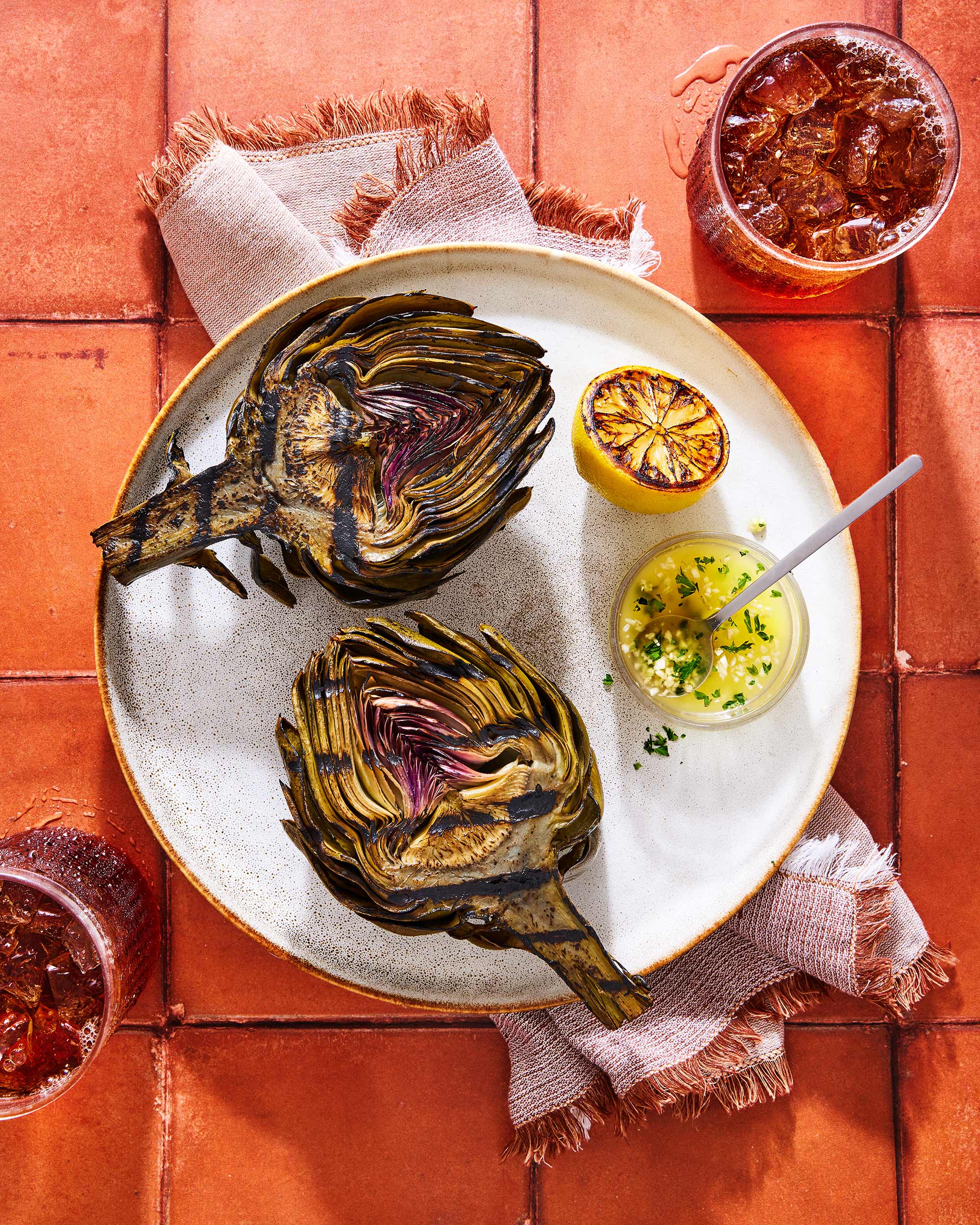 Glanger Food Photography | Grilled Artichokes with lemon, garlic butter dipping sauce and iced teas 