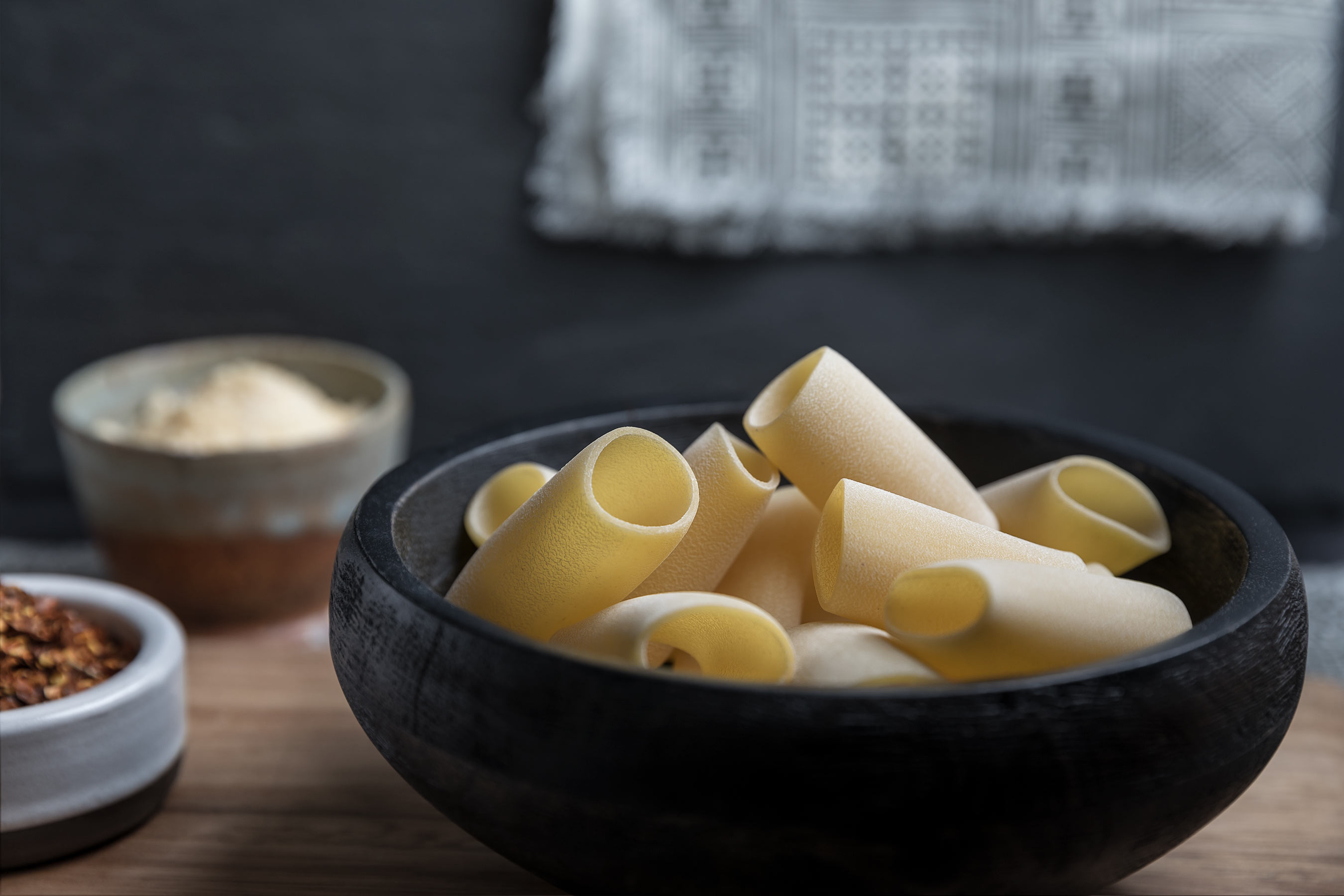 Glanger Photography | Bowls with uncooked rigatoni, pepper flakes and parmesan 
