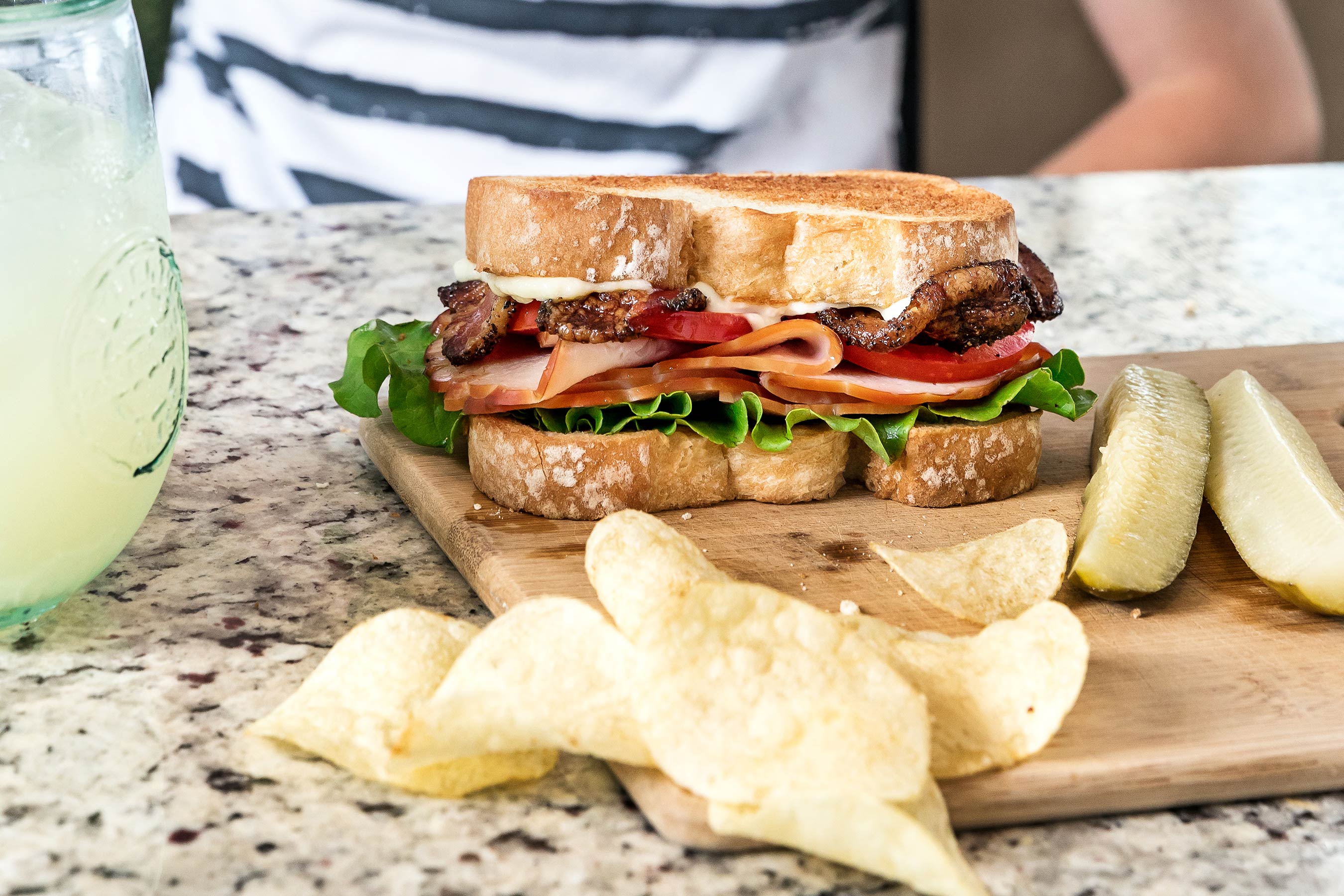 Glanger Photography | Smoked Turkey BLT on white bread with pickles and potato chips