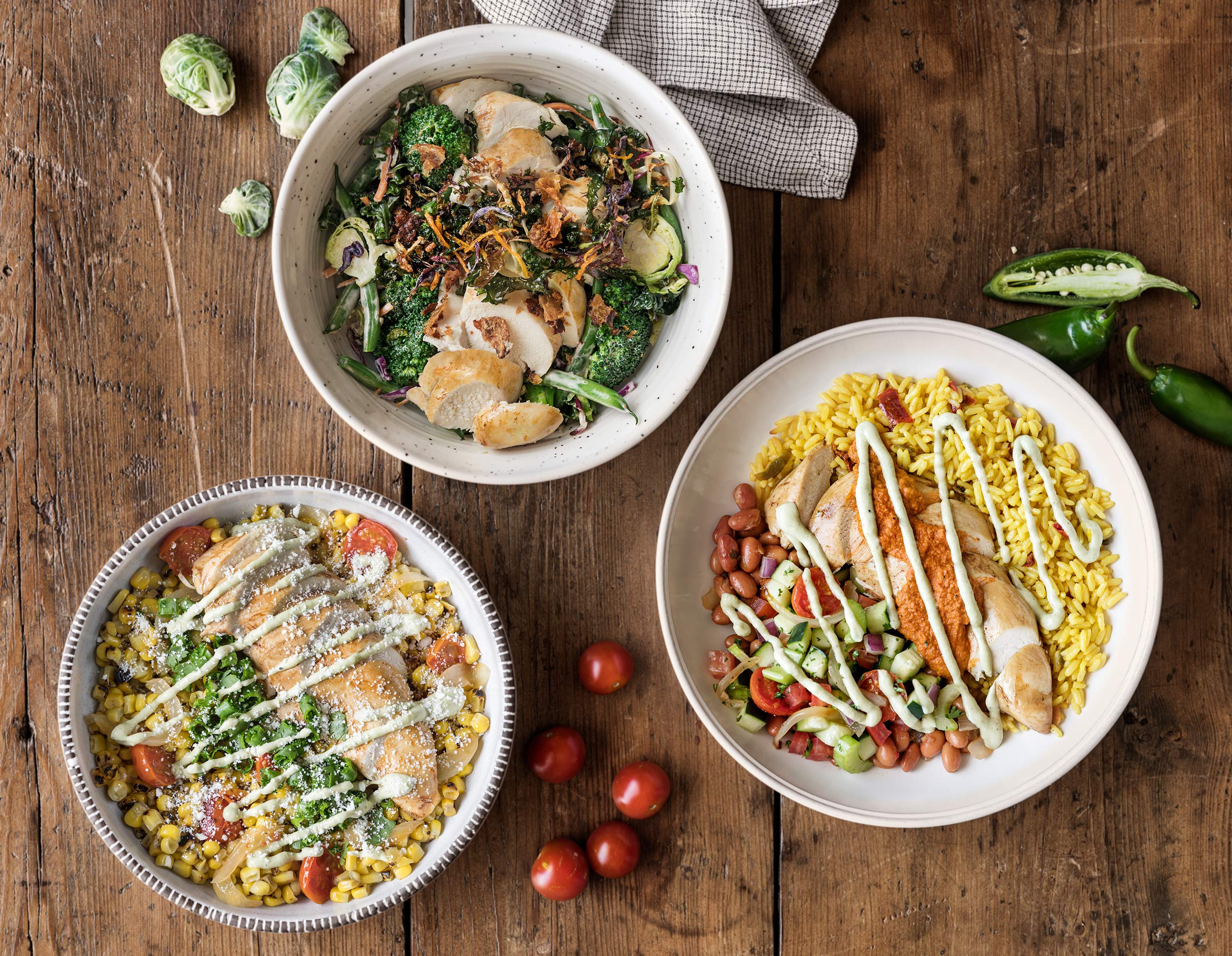3 rotisserie chicken bowls. Corn, beans, rice, broccoli, brussels sprouts