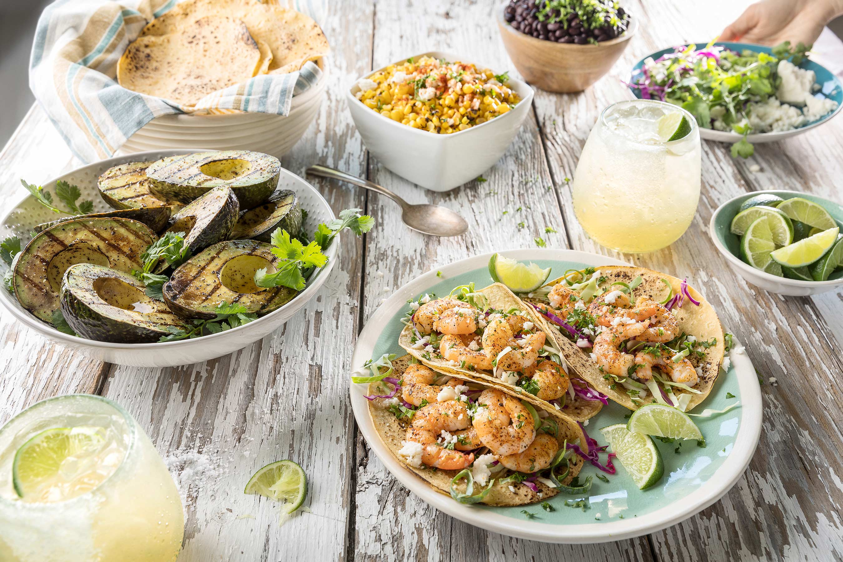 Glanger Photography | Shrimp Tacos with margarita’s, elotes, black beans, avocado and limes