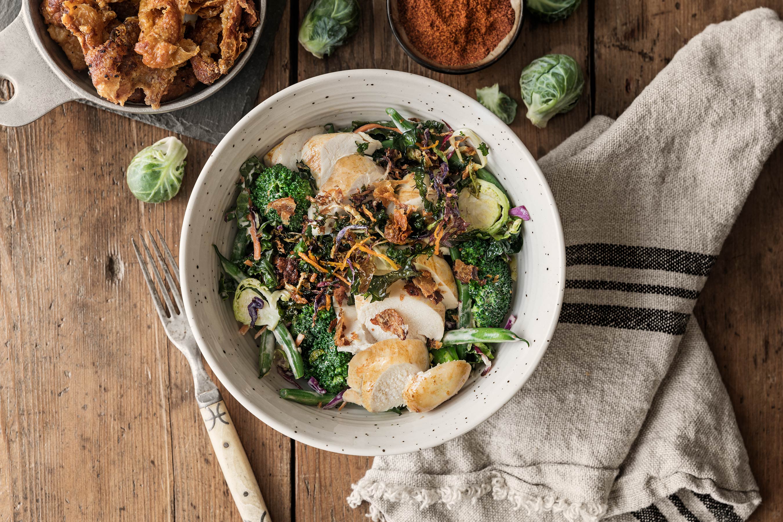 Cowboy Chicken bowl with broccoli, slaw and brussels sprouts. 